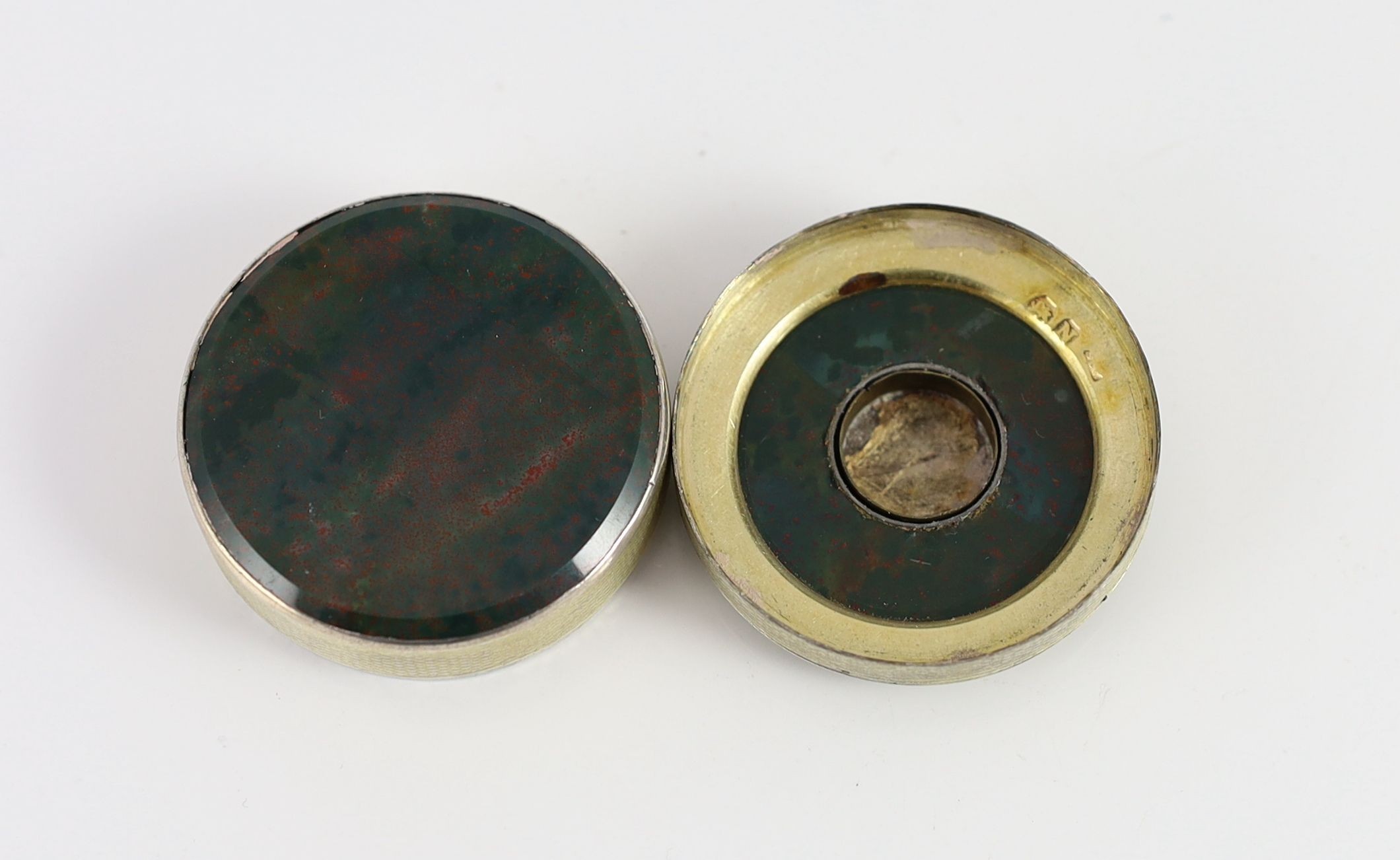 A George III engine turned silver gilt and inset bloodstone circular snuff box and cover, maker's mark rubbed